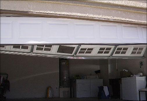repair garage door panel photo - 2
